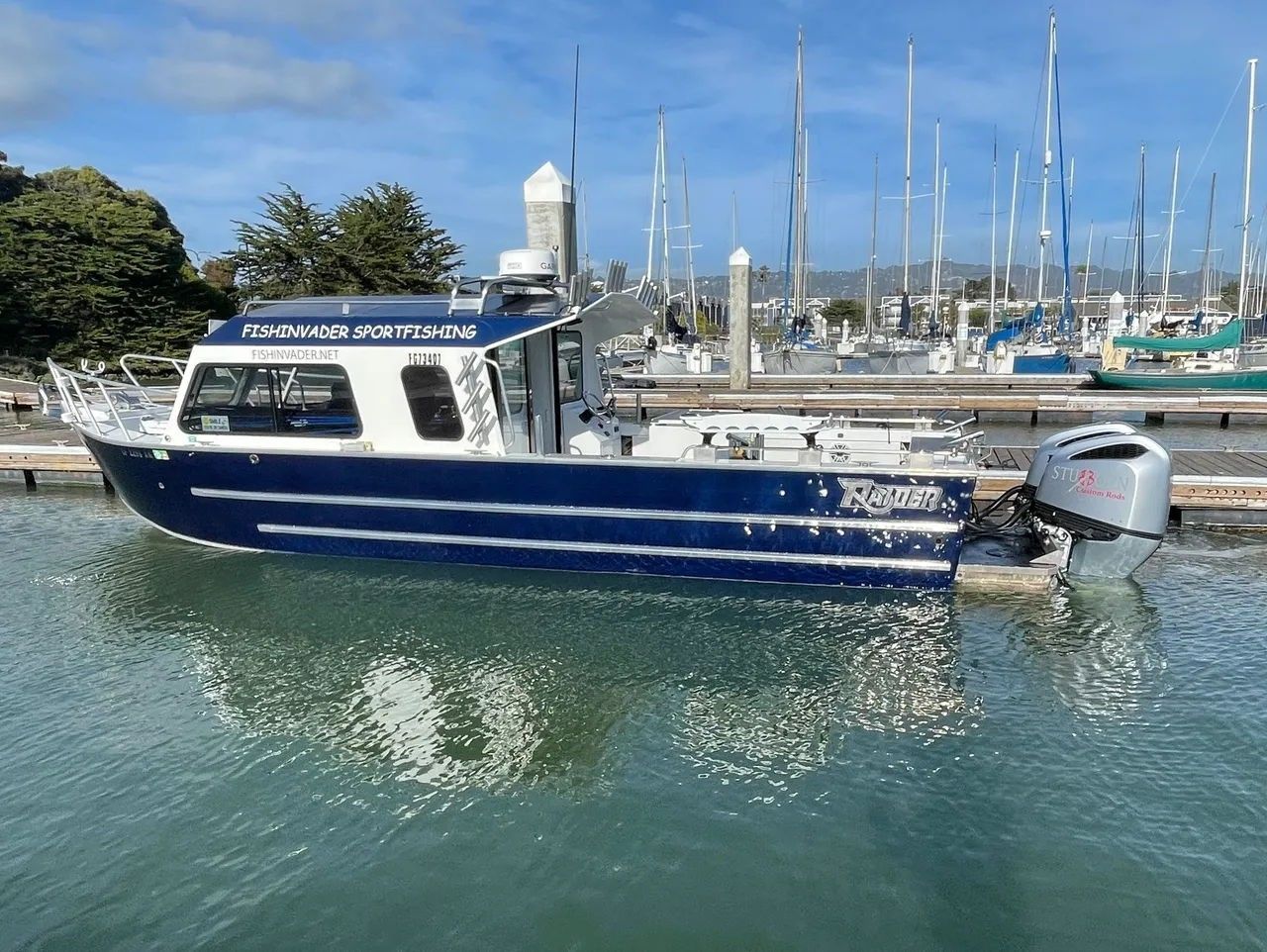 The Fish Invader custom Sea Raider at the marina