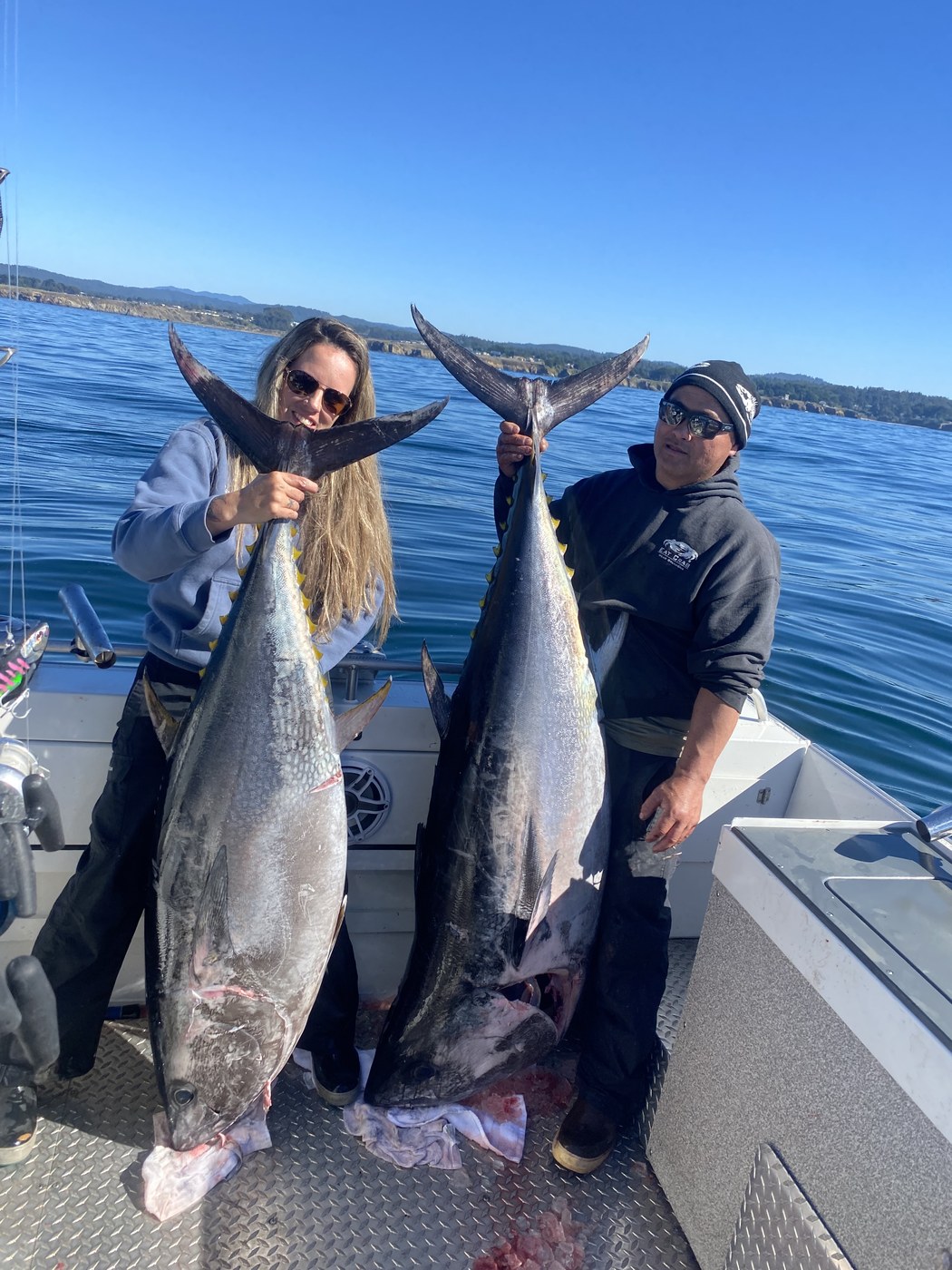 Two anglers with a pair of offshore tuna